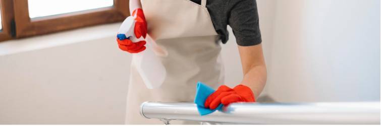 a person wearing gloves and cleaning equipment