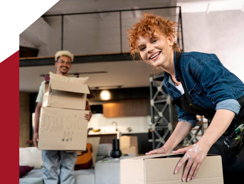 a woman holding a box and smiling