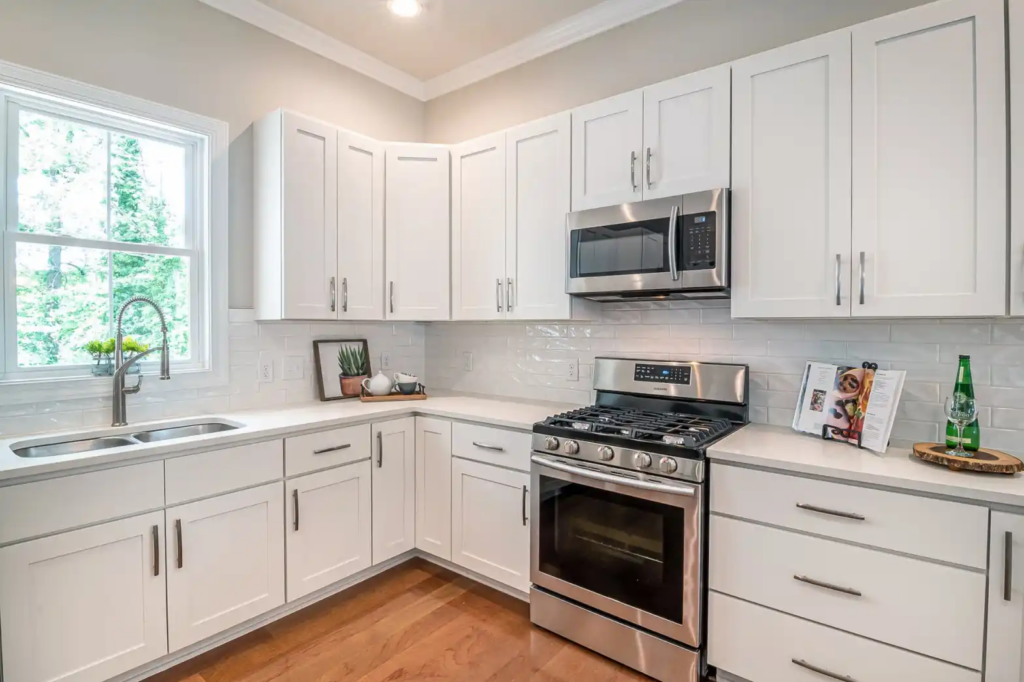 A pristine kitchen with a clean silver oven